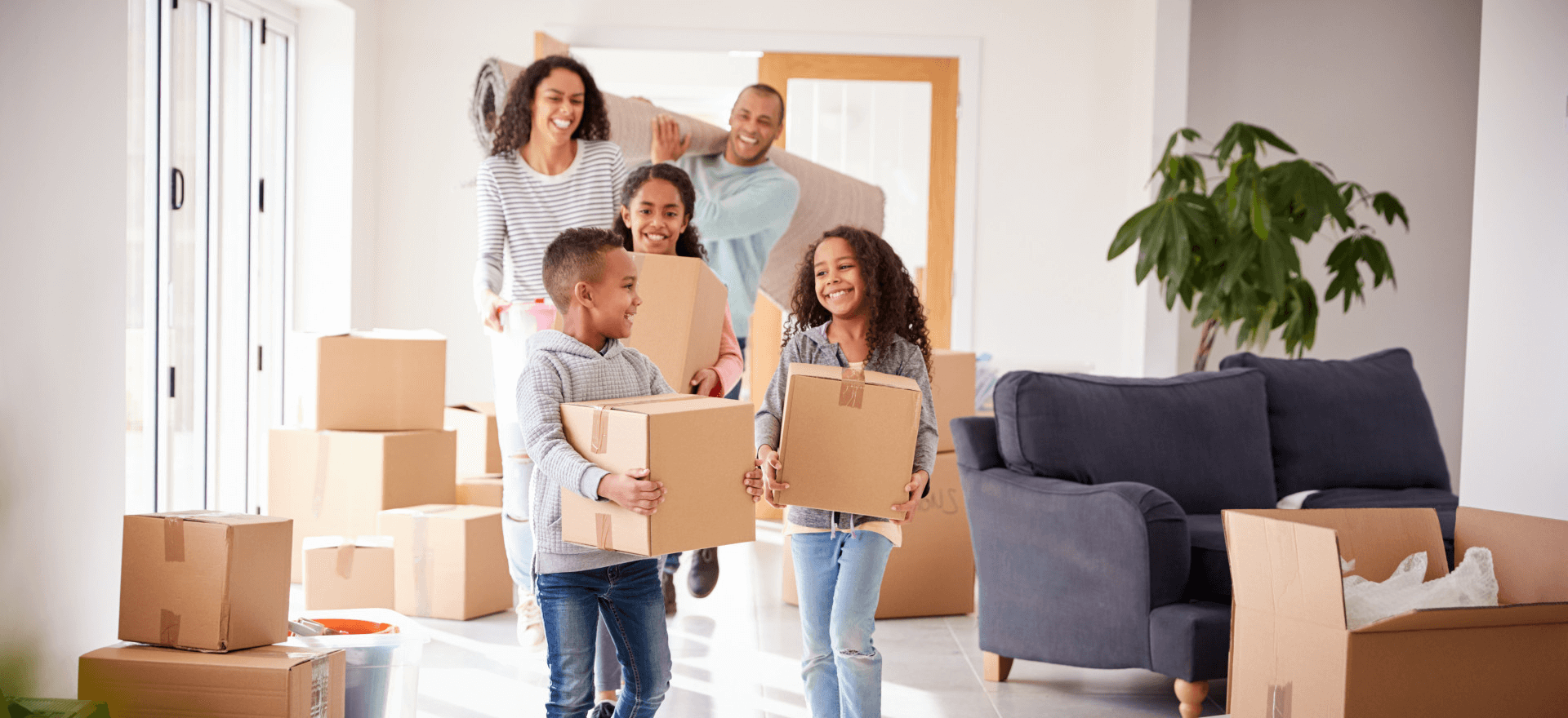 Happy family moving in to their new home thanks to Sanborn Financial